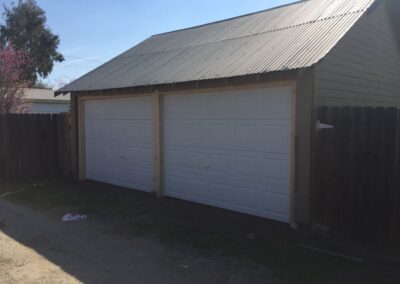 A two-door garage with a pitched roof